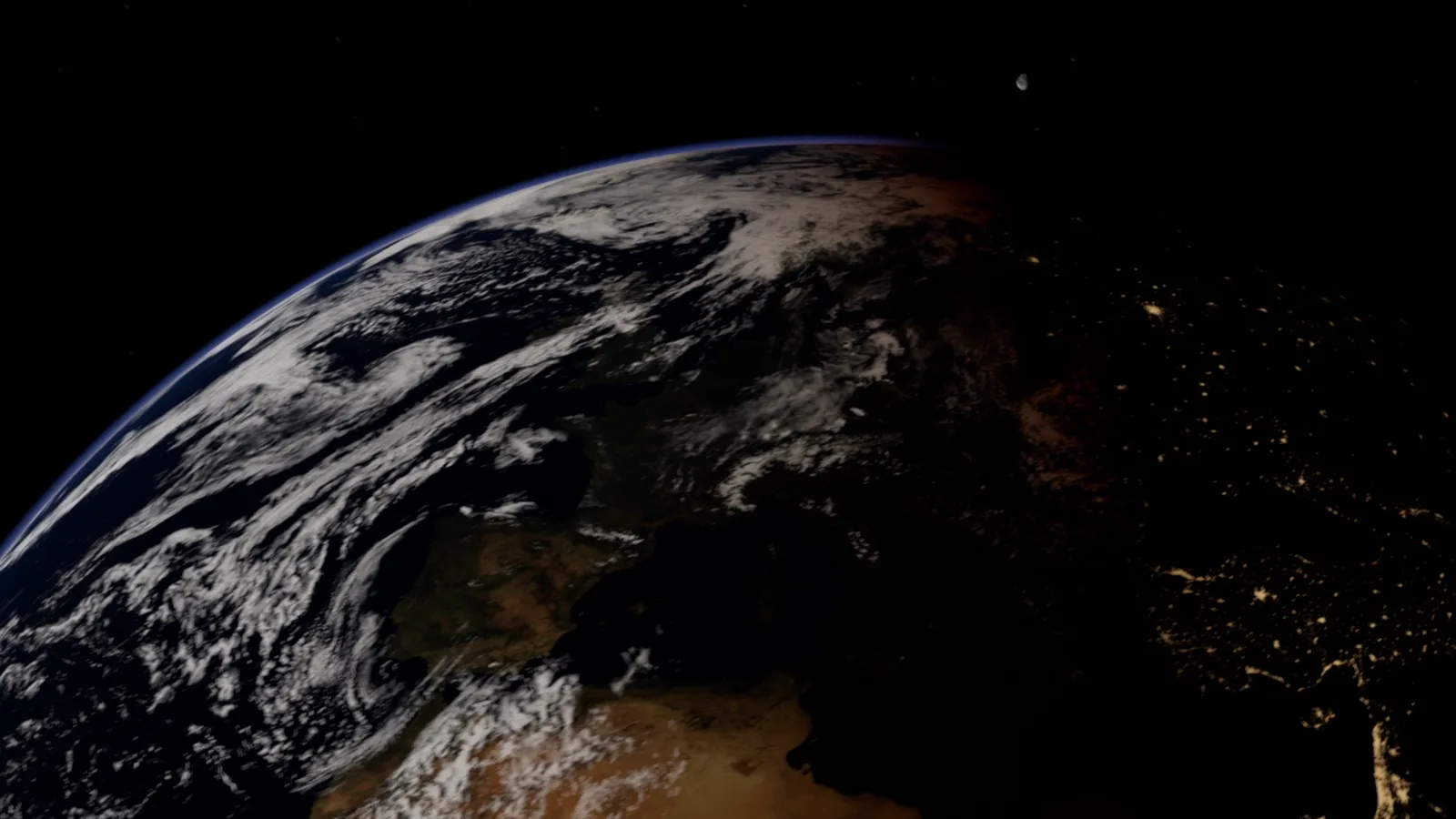 Earth from orbit at the terminator: clouds over Europe and Africa, city lights on the night side