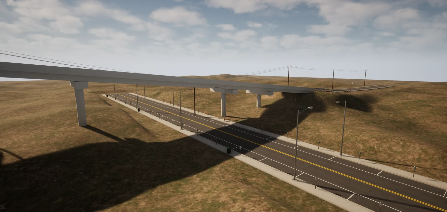 A road carried across a valley on a concrete bridge with piers