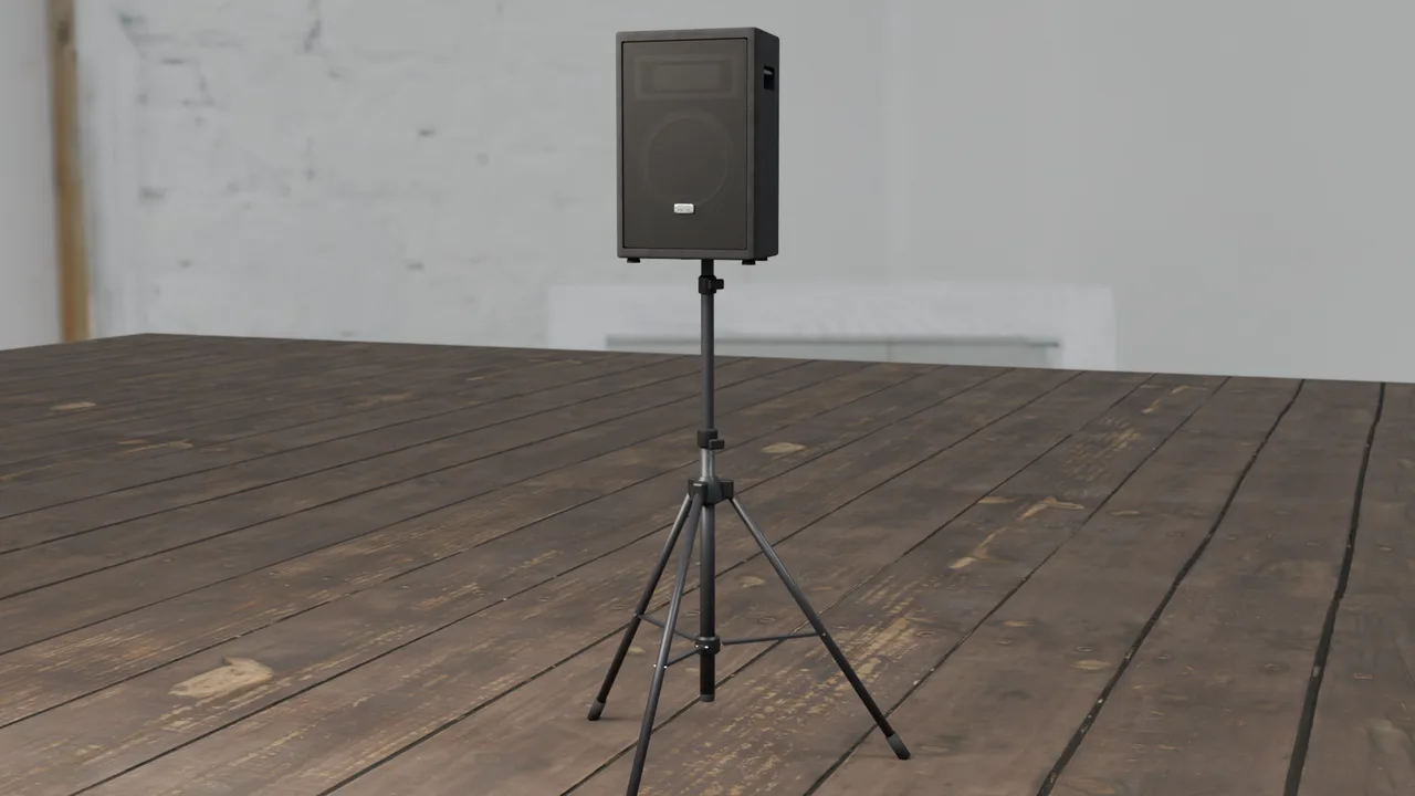 PA speaker on a tripod stand on a wooden stage.